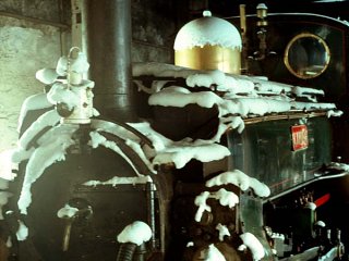 Linda in the Long Shed - The snow settles on the chimney cap and makes an attractive feature